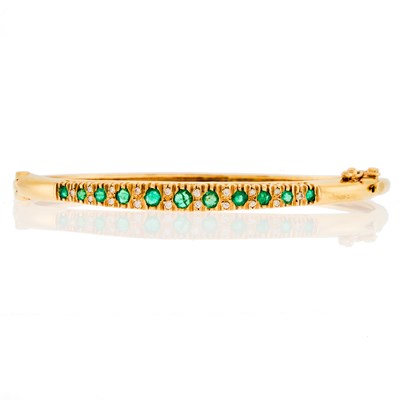 Lot 1227 - Gold, Emerald and Diamond Bangle Bracelet