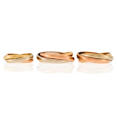 Lot 1093 - Three Tri-Color Gold Rolling Rings