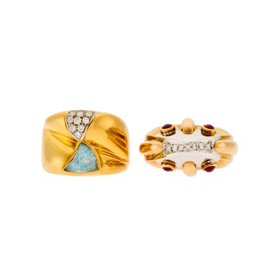 Lot 1255 - Two Two-Color Gold, Blue Topaz, Cabochon Ruby and Diamond Rings