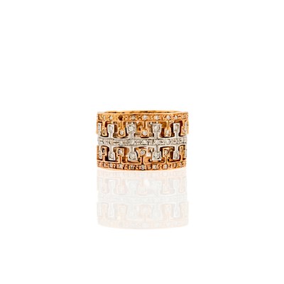 Lot 1265 - Three Two-Color Gold and Diamond Stacking Band Rings