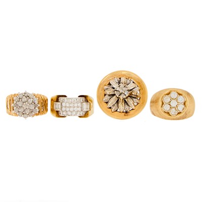 Lot 1276 - Four Two-Color Gold, Platinum, Silver, Diamond and Simulated Diamond Rings