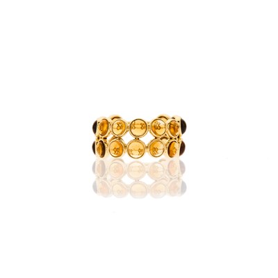 Lot 1018 - Gold and Cabochon Citrine Band Ring