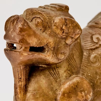 Lot 61 - A Chinese Soapstone Carving of a Recumbent Mythical Beast