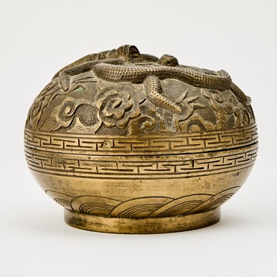 Lot 65 - A Chinese Bronze 'Dragon' Circular Domed Box
