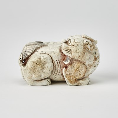 Lot 38 - A Chinese Carved Jade Recumbent Qilin