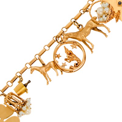 Lot 1051 - Gold, Gem-Set and Cultured Pearl Charm Bracelet