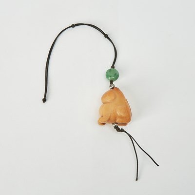 Lot 49 - A Chinese Jade Tiger Pendant
