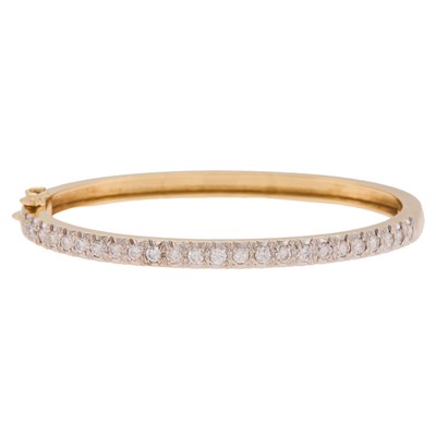 Lot 1105 - Gold, Rhodium-Plated Gold and Diamond Bangle Bracelet
