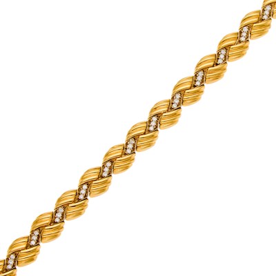 Lot 1122 - Two-Color Gold and Diamond Bracelet
