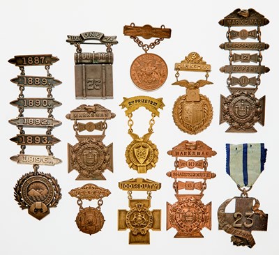 Lot 105 - United States. Group of 19th and 20th Century Military and Police Marksmanship Badges. Grades Vary.