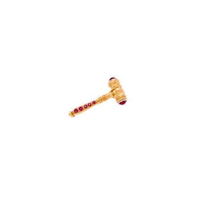 Lot 1034 - Gold, Ruby and Cabochon Synthetic Ruby 'Gavel' Pin