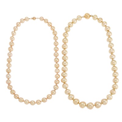 Lot 1164 - Two Golden Semi-Baroque Freshwater Pearl Necklaces with Gold Clasps
