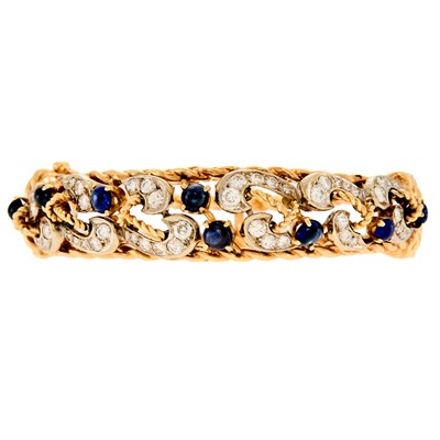Lot 1023 - Two-Color Gold, Cabochon Sapphire and Diamond Bangle Bracelet