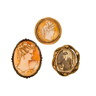 Lot 1067 - Two Silver and Low-Karat Gold Shell Cameo Brooches and Gilt-Metal Locket-Brooch