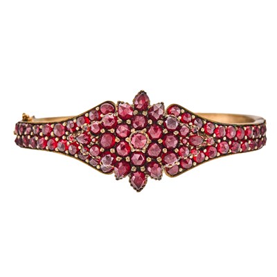 Lot 1096 - Antique Gilt-Metal and Garnet Bangle Bracelet