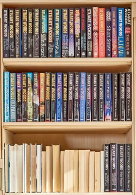 Lot 189 - Group of volumes by Stuart Woods, many inscribed to "Annie" composer Charles Strouse