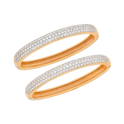 Lot 87 - Pair of Two-Color Gold and Diamond Bangle Bracelets