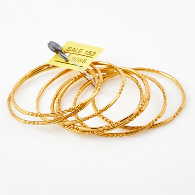 Lot 86 - Eight Gold Rigid Bracelets, 22K 67 dwt.