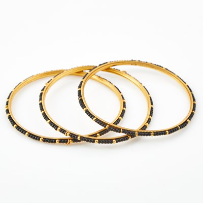 Lot 99 - Three Gold and Bead Rigid Bracelets, 22K 22 dwt. all