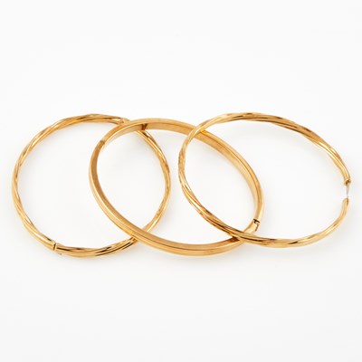 Lot 321 - Three Gold Rigid Bracelets, 18K 13 dwt.