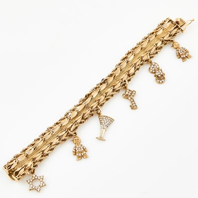Lot 482 - Gold Charm Bracelet with 6 gold and stone charms attached, 14K and 10K 21 dwt. all, stone missing
