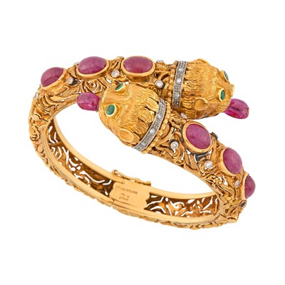 Lot 107 - Ilias Lalaounis Gold, Cabochon and Ruby Bead, Emerald and Diamond Chimera Crossover Bangle Bracelet
