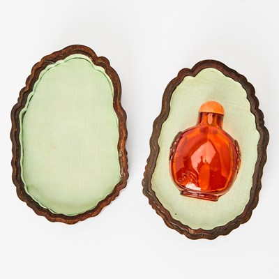 Lot 2 - A Chinese Carved Amber Snuff Bottle with a Zitan Box
