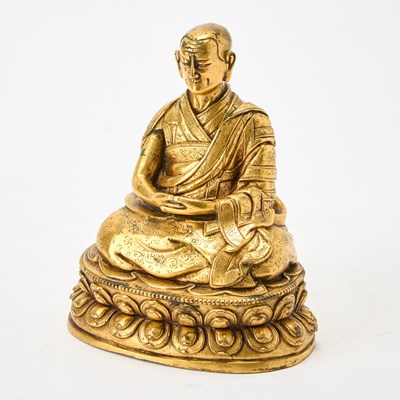 Lot 321 - A Tibetan Gilt Bronze Figure of Lama