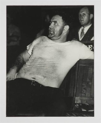 Lot 240 - WEEGEE [=FELLIG, ARTHUR] [The janitor takes...