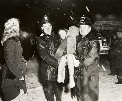 Lot 3240 - WEEGEE Untitled [Woman Rescued from Fire]....